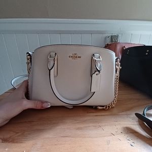 Small, white Coach Purse